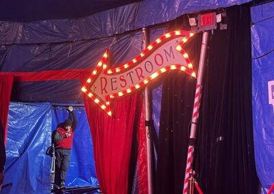 Big Apple Circus wavy arrow to rest room